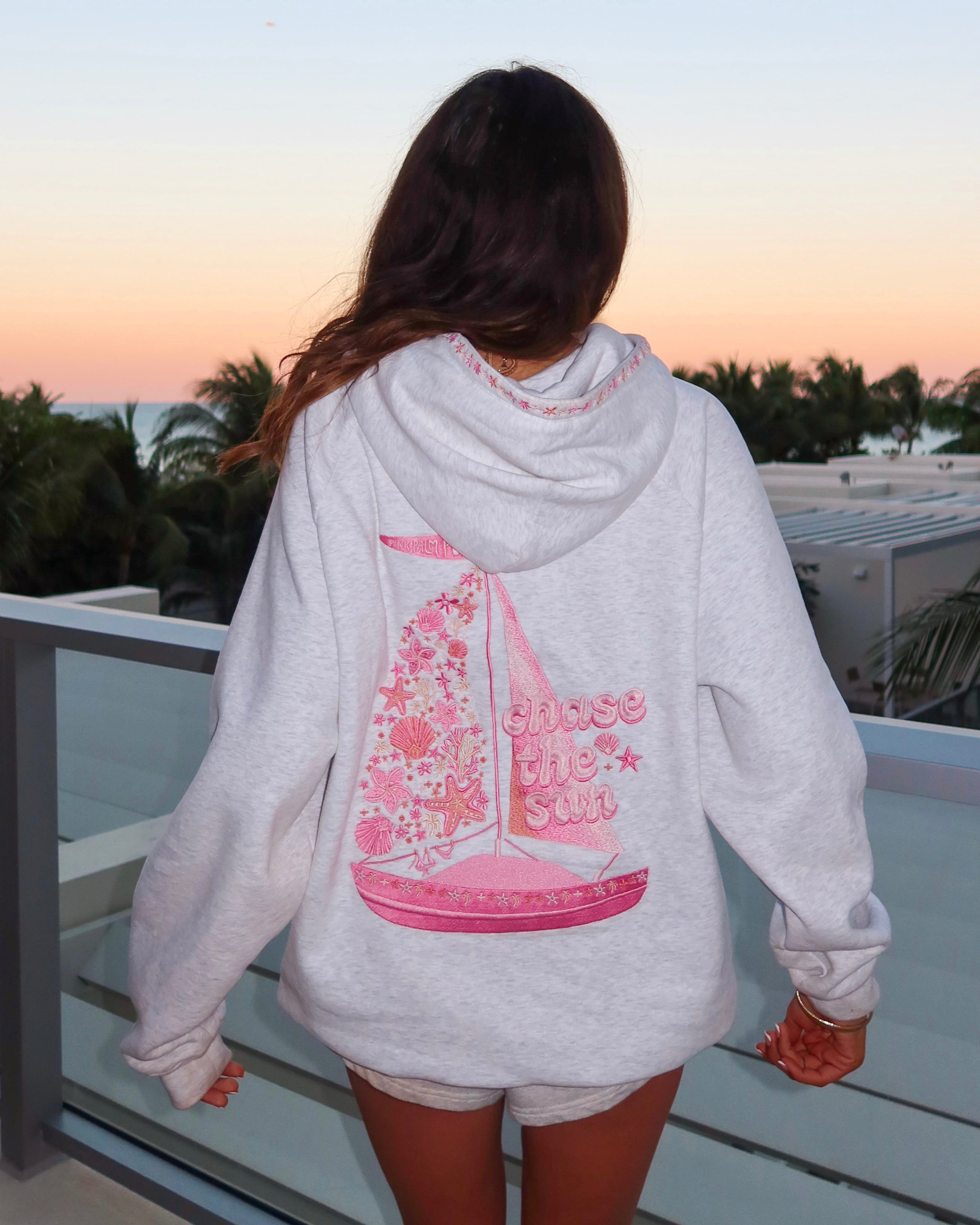 "Chase the Sun" Relaxed Hoodie, relaxed fit with an adjustable drawstring hood and pocket, in Heather Cloud - coastal preppy aesthetic beach style by Pink Palm Puff